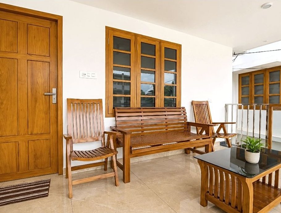 Teak wood lounge seating near the villa entrance