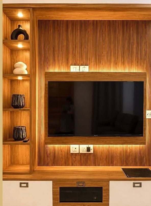 Smart TV mounted on a wooden media wall